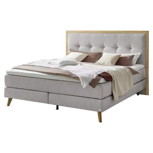 Boxspringbett grau mit Holzrahmen, Polsterkopfteil und Metallbeinen – modernes Schlafzimmer
